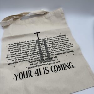 An inspirational Christian tote bag by Designs By DivaRn with the powerful message 'Your 41 Is Coming' printed in black, explaining the biblical meaning of breakthrough.