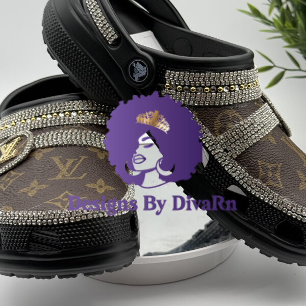 Brown clogs with a crystal lattice pattern and designer-inspired charms.