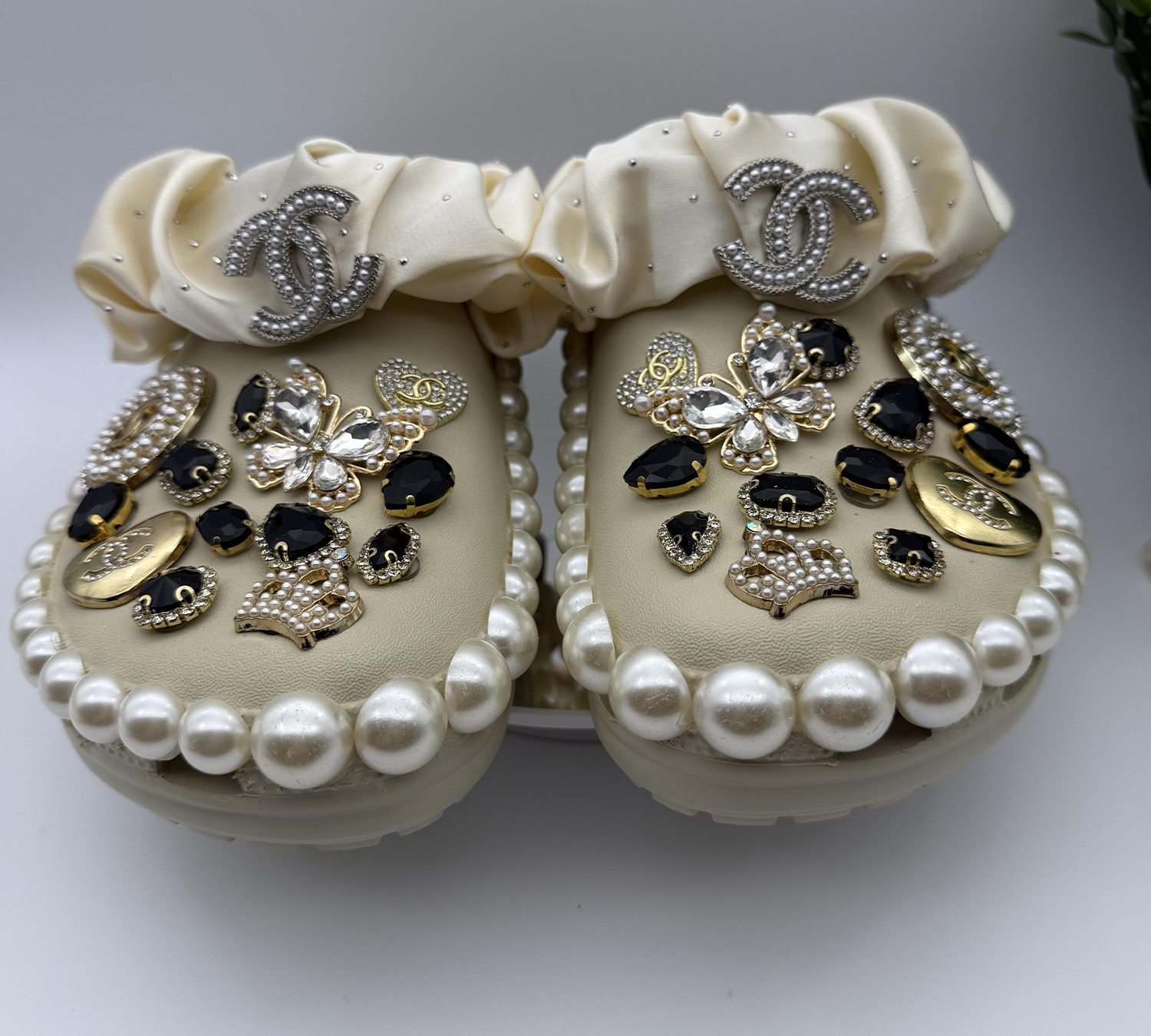 Chic-Beige-Clogs-with-Black,-Gold-Jewels,-and-Pearl-Trim